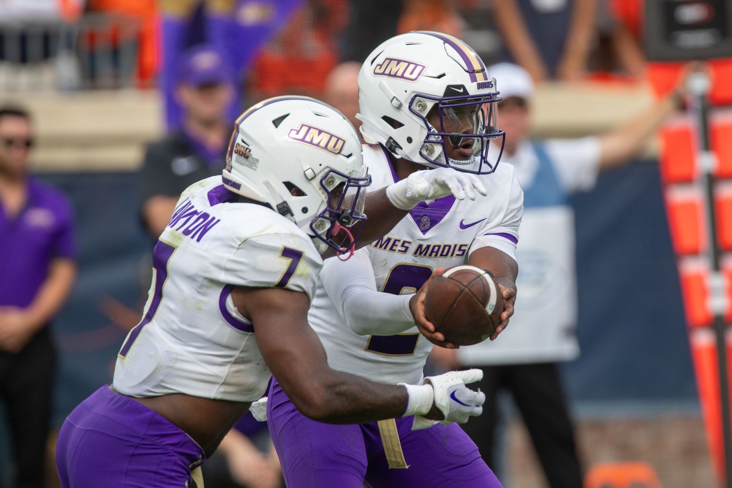 James Madison quarterback Jordan McCloud hands the ball off to running back Ty Son Lawton during the Dukes' 36-35 win over Virginia on Sept. 9, 2023.